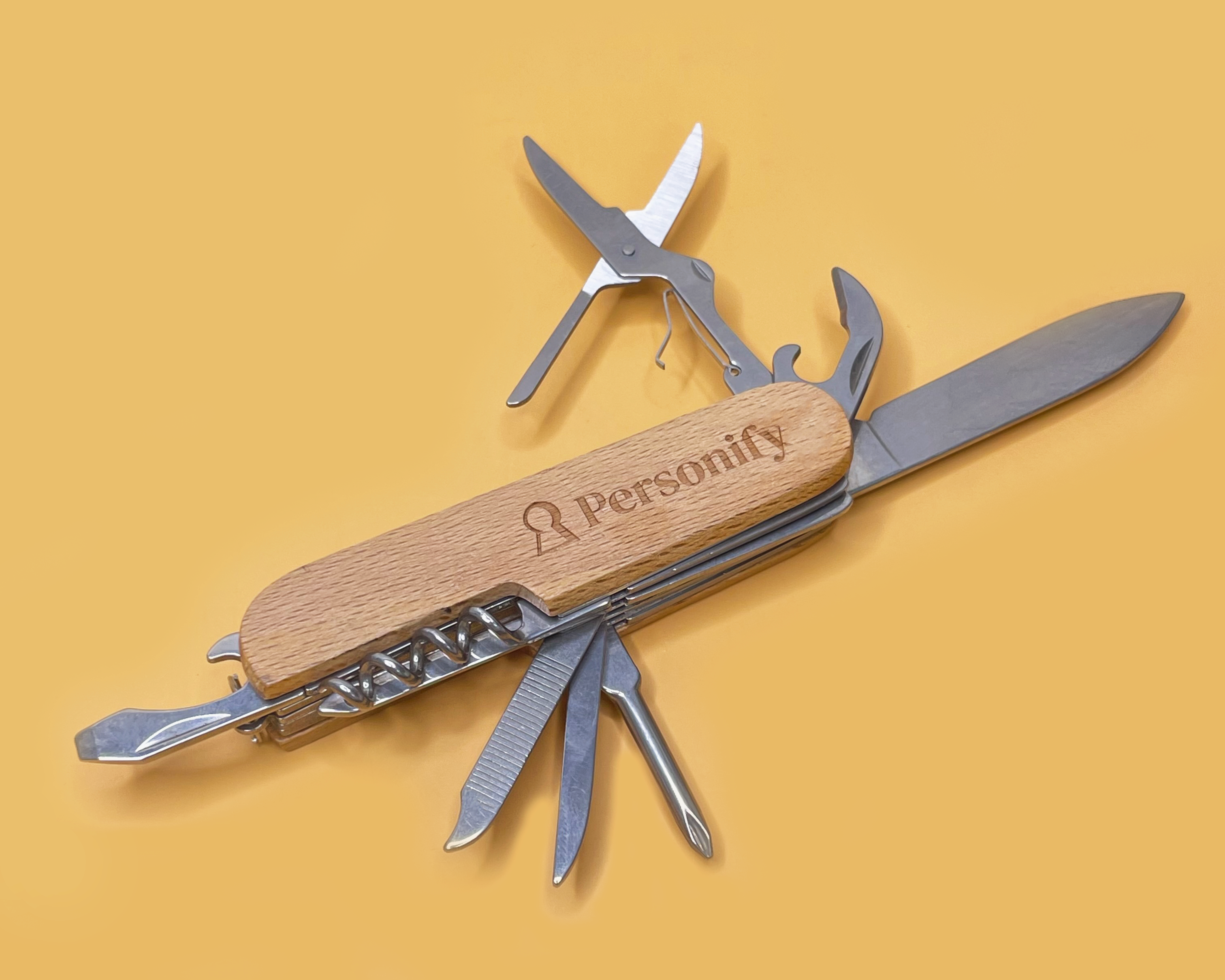 Multitool with wooden handle and 'Personify' branding on a yellow background