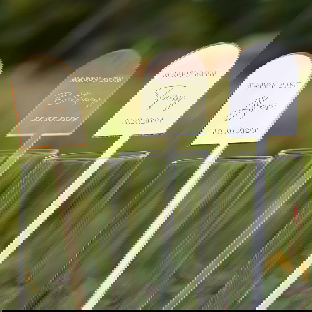 Birthday Arch Drink Stirrers samples in gold acrylic, clear acrylic, and silver acrylic materials