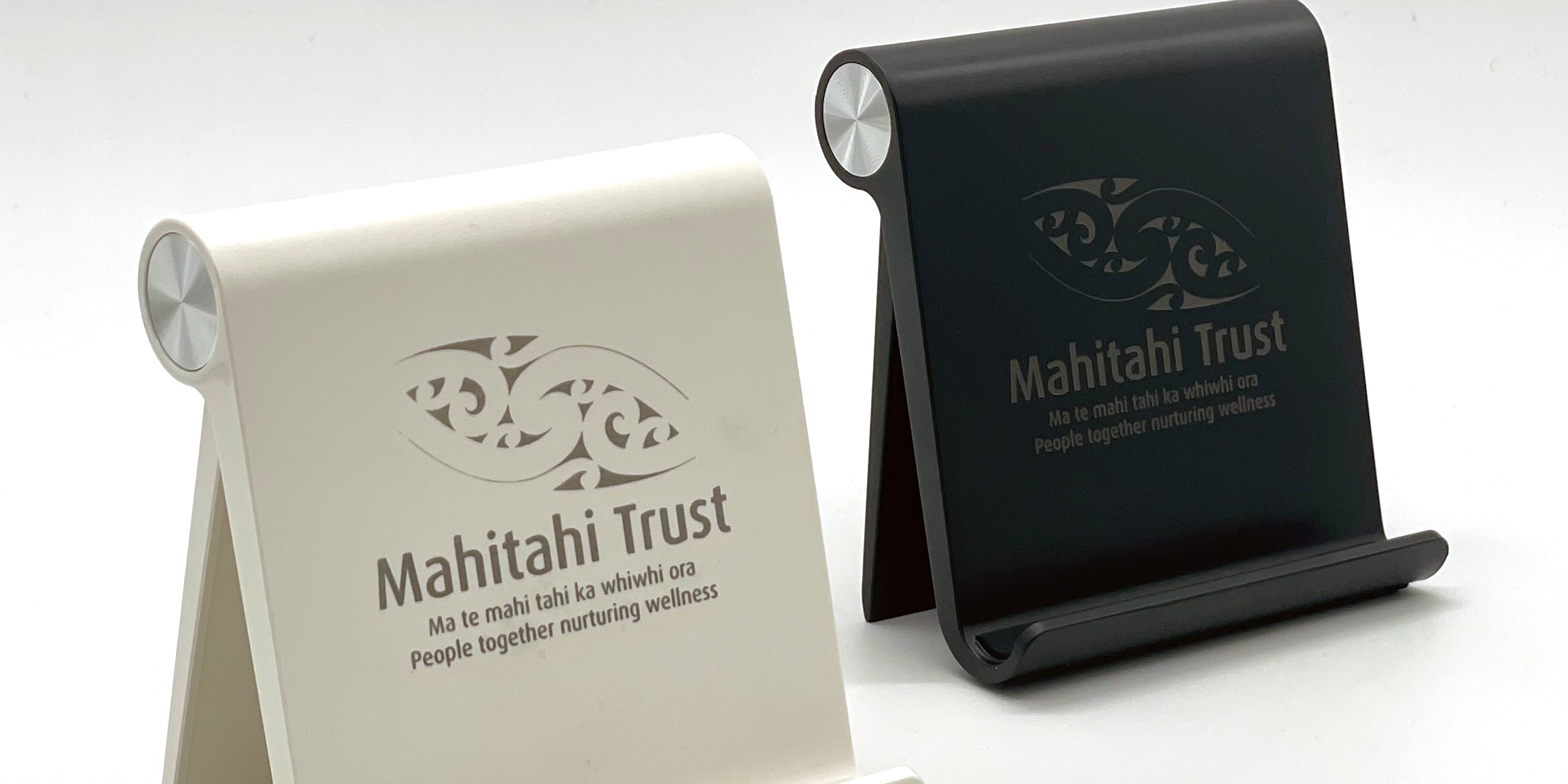 black and white phone stand with engraving