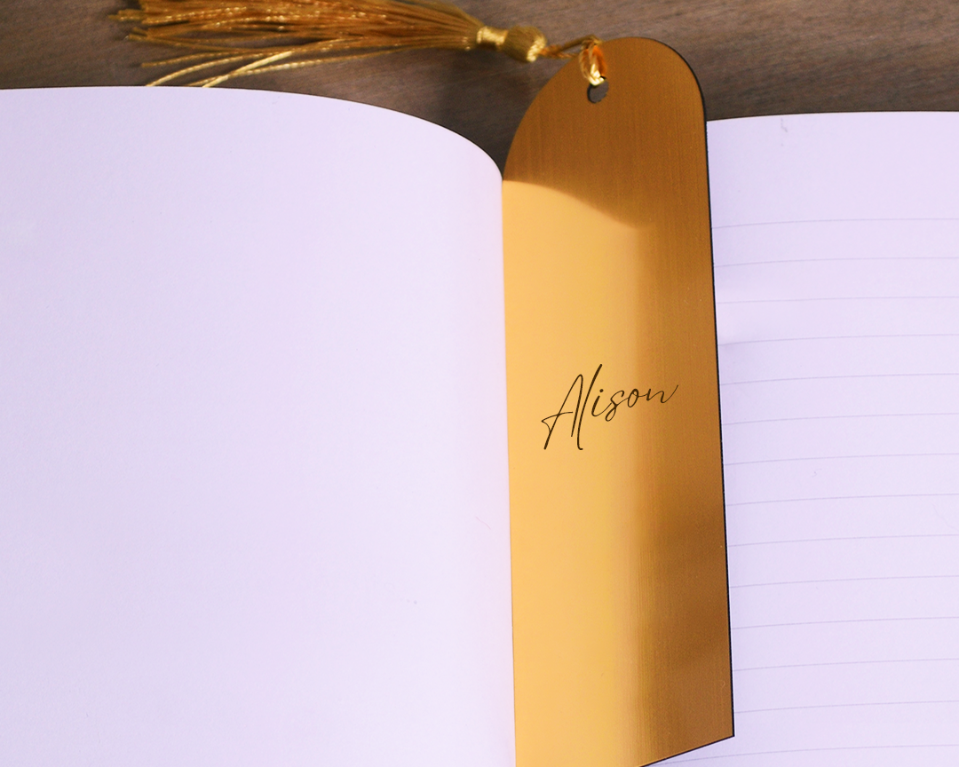 Bookmark-Standard_Rounded-Top_Gold_01_Image_Lifestyle_64eb5c80-1cef-4599-bff9-39ebd47e3cc7.png
