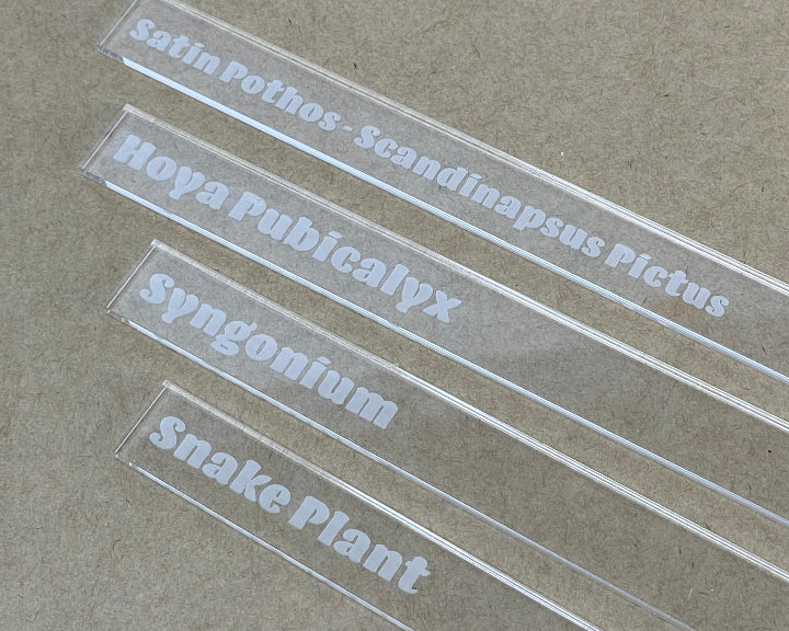 Samples of clear acrylic plant marker with engraving