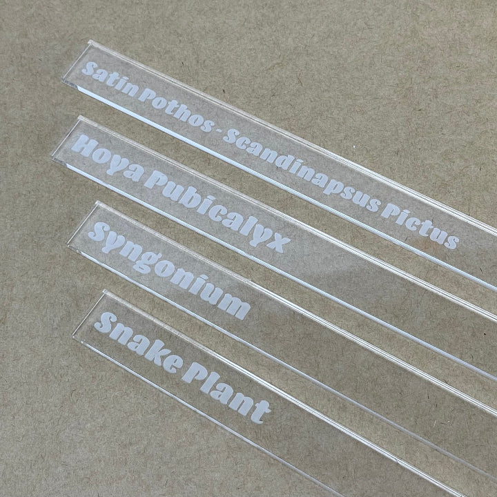 Samples of clear acrylic plant marker with engraving