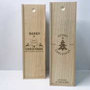 Two wooden wine boxes with Christmas designs and text on a light gray background